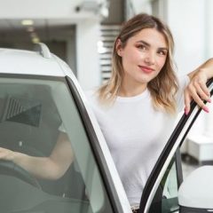 young_woman_car_dealership.jpg