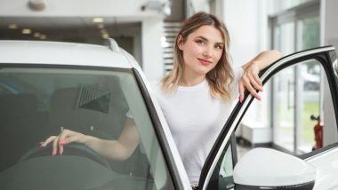 young_woman_car_dealership.jpg