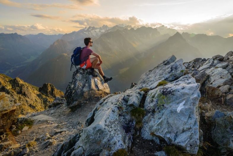 man-hiking-climbing-peak-view.jpg