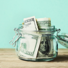 saving_money_dollar_bills_jar.png